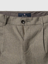 Close-up of the waistband and front of the BGkyoto Wool Pant - Grey Mel from Blue de Gênes, featuring a button closure, zipper, belt loops, and a label reading “Blue de Gênes” sewn inside the waistband.