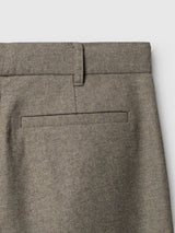 Close-up of the upper back section of the Blue de Gênes BGkyoto Wool Pant - Grey Mel, featuring a belt loop and a single welt pocket against a white background.