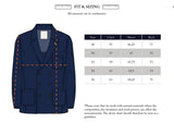 Illustration of the BGlewis Wool Blazer - Dark Navy by Blue de Gênes, showing a navy blue double-breasted blazer with measurement lines. Next to the illustration is a sizing chart listing chest, sleeve, and back lengths in centimeters for sizes 48 to 54. Text notes that measurements are approximate. Designed with relaxed tailoring, this blazer blends modern comfort with classic style.