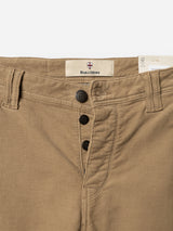 Close-up of sepia tint brown BGpaulo Ottawa V3 trousers with a slim fit, three black buttons on the fly, visible stitching, belt loops, and a Blue de Gênes label inside the waistband.