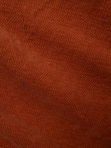 Close-up of Blue de Gênes BGpaulo Ottawa V3 Trousers in Ginger Bread Orange, featuring reddish-brown textured dobby corduroy fabric with a visible diagonal weave pattern and gentle folds—often chosen for slim fit chino styles.