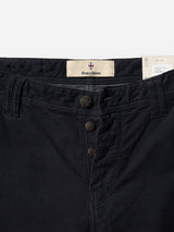 Close-up of the waist and upper section of the BGpaulo Ottawa V3 Trousers in dark navy, featuring three visible buttons and belt loops. A label inside the waistband reads Blue de Gênes. The textured corduroy fabric adds a refined touch to these modern chino pants.