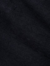 A close-up view of the dark navy fabric from the BGpaulo Ottawa V3 Trousers by Blue de Gênes, highlighting the intricate weave and subtle texture that evoke the refined look characteristic of slim fit chino pants.