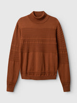 Blue de Gênes BGstu Rollneck Knit in ginger bread orange, featuring a roll-neck, ribbed cuffs, and textured horizontal knit panels across the chest and sleeves.