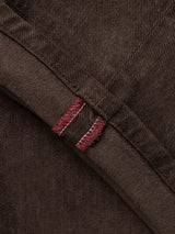 Close-up of BGvinci Iro Pant - Hot Fudge Brown comfort stretch twill pants featuring a folded seam reinforced with burgundy decorative stitching.