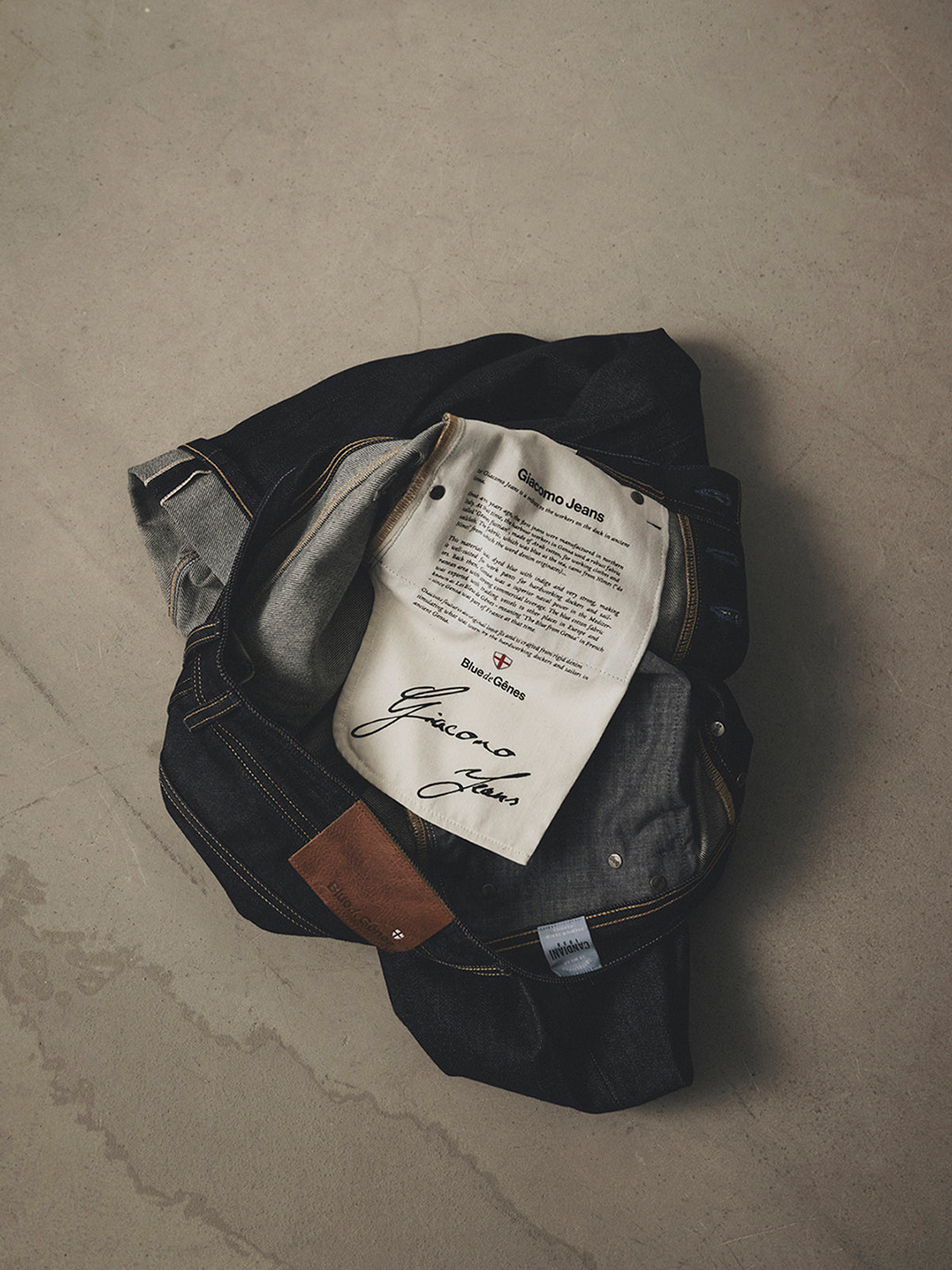 Folded dark raw denim BGgiacomo Selvedge V3 Jeans - Raw Denim with a relaxed loose fit and a printed fabric label on the inside pocket.