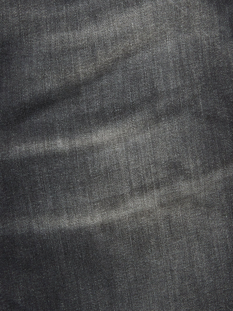 Close-up of Vinci G Dark Grey Jeans by Blue de Gênes in grey comfort stretch denim, featuring visible texture, faded lines, and the characteristic weave with natural wear patterns.