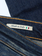 Close-up of a Blue de Gênes label reading Made in Italy, featuring a small Italian flag, sewn onto Repi Dark Vintage Jeans - Mid Blue Denim with comfort stretch and visible yellow stitching.
