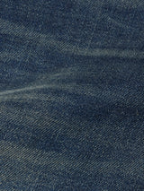 Close-up of Blue de Gênes Repi Dark Vintage Jeans in mid blue denim highlights the comfort stretch fabric’s detailed weave, subtle color variations, and gentle creasing typical of quality craftsmanship.