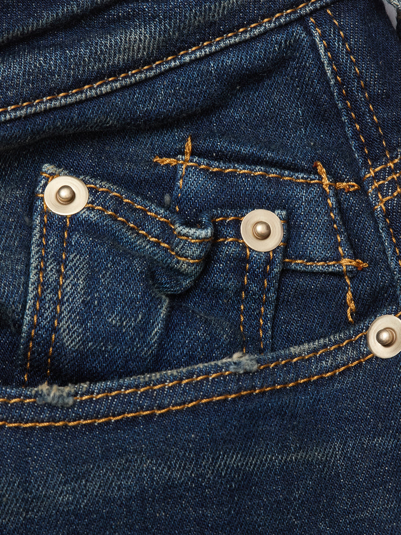 Close-up of Repi Dark Vintage Jeans by Blue de Gênes in mid-blue denim, featuring comfort stretch fabric, visible stitching, rivets, and a small coin pocket inside the front pocket.