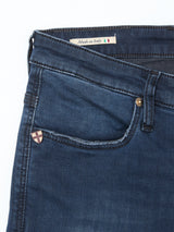 A close-up of Blue de Gênes Repi BlueBlk Used Jeans in blue-black denim shows the front pocket, metal rivet, a badge, and a Made in Italy label with flag, highlighting the comfort stretch fabric for ease and style.