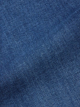 Close-up of Recco Blue Vintage Jeans - Vintage Wash by Blue de Gênes, highlighting the detailed weave pattern and texture of the blue denim fabric with a diagonal seam visible.