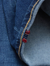 Close-up of the cuff on Blue de Gênes Recco Blue Vintage Jeans in vintage wash, highlighting red and white stitched inside seams and a yellow-threaded edge detail on blue denim.