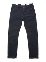 The BGpaulo Ottawa Trousers by Blue de Gênes are dark navy corduroy chinos featuring side and back pockets, button and zipper closure, and rolled cuffs with red and navy stripes. Shown laid flat on a white background.