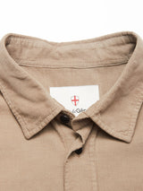 Close-up of the Zamboni Velu Shirt - Fungi by Blue de Gênes, showing its tan baby corduroy collar, partially unbuttoned, and a white neck label with the brand’s red shield logo and black text.