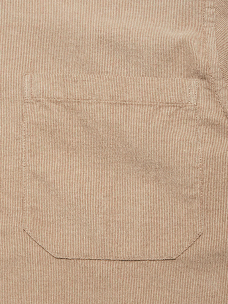 Close-up of the Blue de Gênes Zamboni Velu Shirt - Fungi, featuring a stitched pocket and fine vertical ridges that highlight the garment-dyed corduroy’s soft texture and quality.