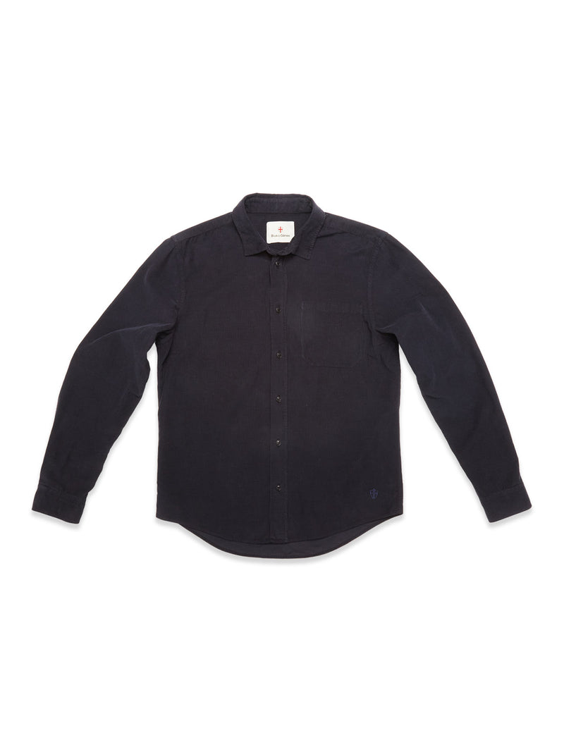 The Blue de Gênes Zamboni Velu Shirt in navy is a long-sleeve, button-up baby corduroy shirt with a chest pocket and classic collar, garment dyed for a rich finish, inspired by Blue de Gênes craftsmanship.