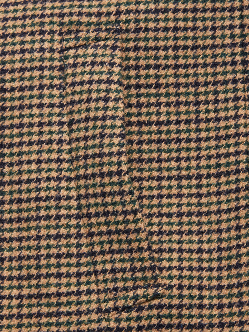 Close-up of the Massone Check Coat - Multi Check by Blue de Gênes, featuring brown and black houndstooth-patterned Melton wool with a seamlessly hidden pocket.