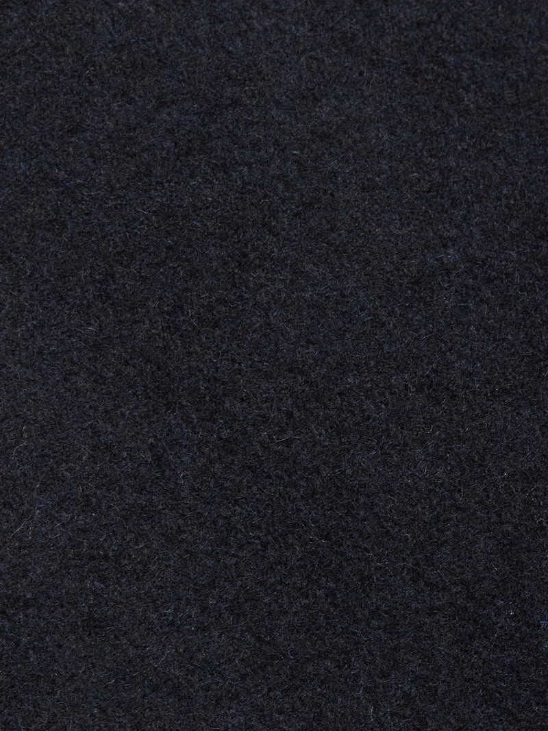 Close-up view of the Blue de Gênes Shiba Melton Coat in Dark Navy, showing its dark, textured Melton wool surface with a soft, slightly fuzzy finish.