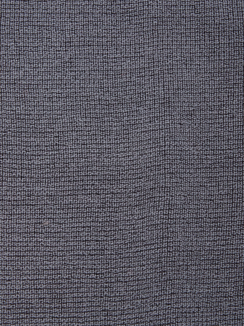 Close-up of Blue de Gênes’ Porto Knit in Dark Slate, featuring a textured fabric with a subtle grid-like woven pattern and small, raised rectangular shapes—perfect for menswear.
