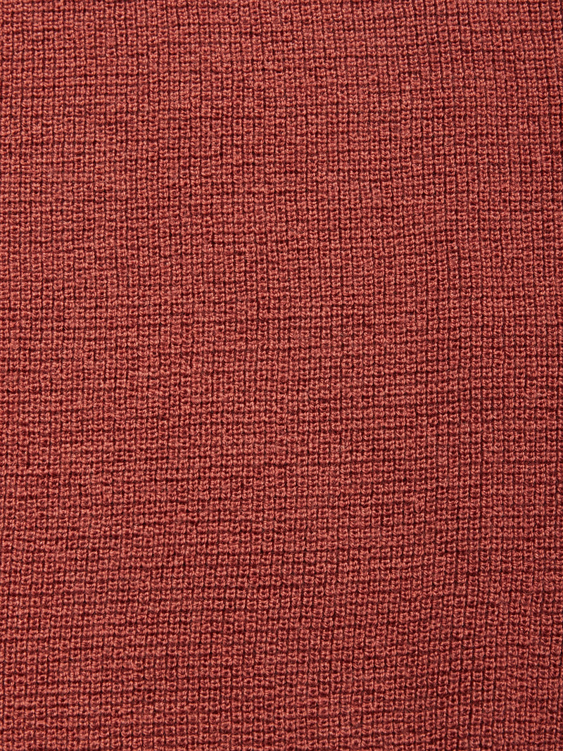 Close-up of the Porto Knit - Henna by Blue de Gênes, featuring a textured red grid-like weave inspired by timeless menswear classics.