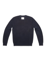 The Blue de Gênes Porto Knit in navy is a classic men's wool crewneck sweater, shown laid flat on a white background with a small white tag at the neckline.