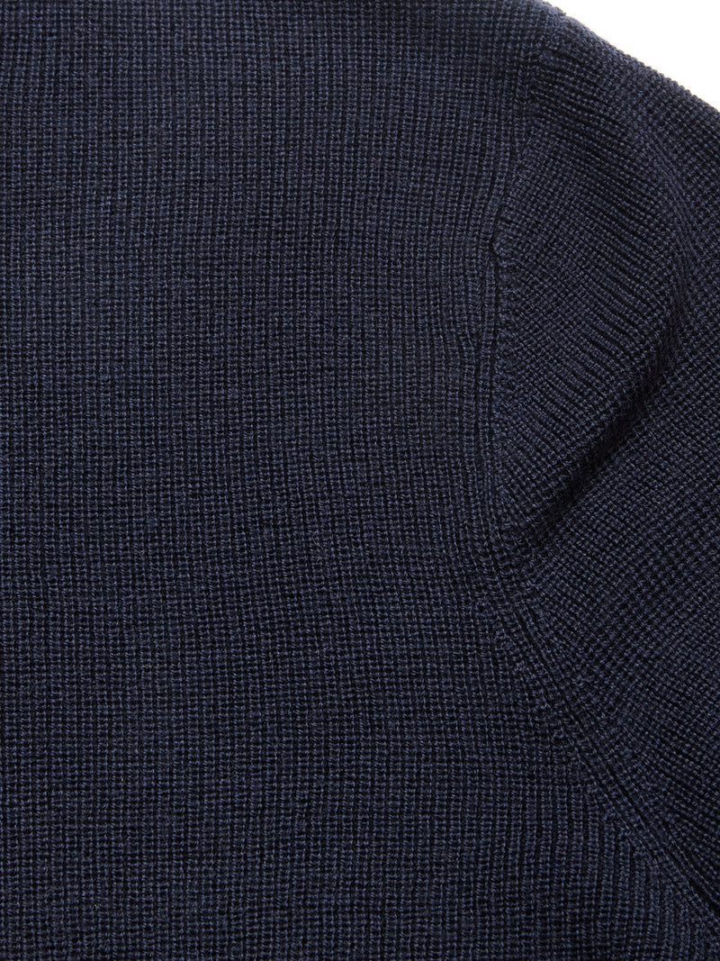 Close-up of the Porto Knit - Navy by Blue de Gênes, highlighting its detailed ribbed knit texture and fine stitching—ideal for classic menswear style.