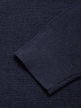Close-up of the Porto Knit - Navy by Blue de Gênes, highlighting the detailed textured wool weave and the cuff of this long-sleeved menswear crewneck sweater.