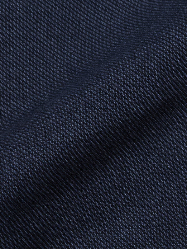 Close-up of a dark blue, textured fabric with a diagonal weave—perfect for cotton blend chinos or the refined Menzo Olanda Chino by Blue de Gênes, known for its signature tapered leg.