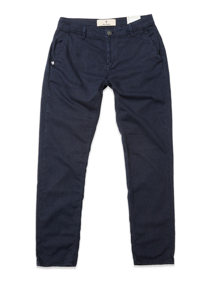 A pair of Blue de Gênes Menzo Olanda Chino in navy, laid flat on white, featuring a cotton blend, button and zipper closure, front and back pockets, belt loops, and a modern tapered leg.