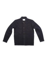 The Blue de Gênes Kojima Wool Jacket - Navy, made from soft boiled wool with a collar, button-down front, long sleeves, and two large front pockets, is shown laid flat on a white background.