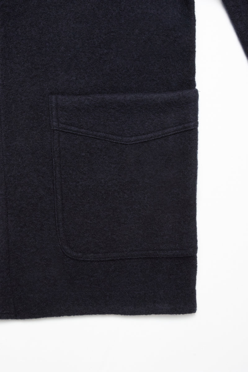 Close-up of the Blue de Gênes Kojima Wool Jacket in navy, featuring a large rectangular front pocket with a pointed flap, against a white background.