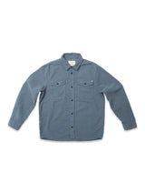 The Blue de Gênes Nagano Overshirt in Dark Slate is a long-sleeve, button-up garment dyed cotton Moleskin shirt with two chest pockets and a collar, shown laid flat on a white background.