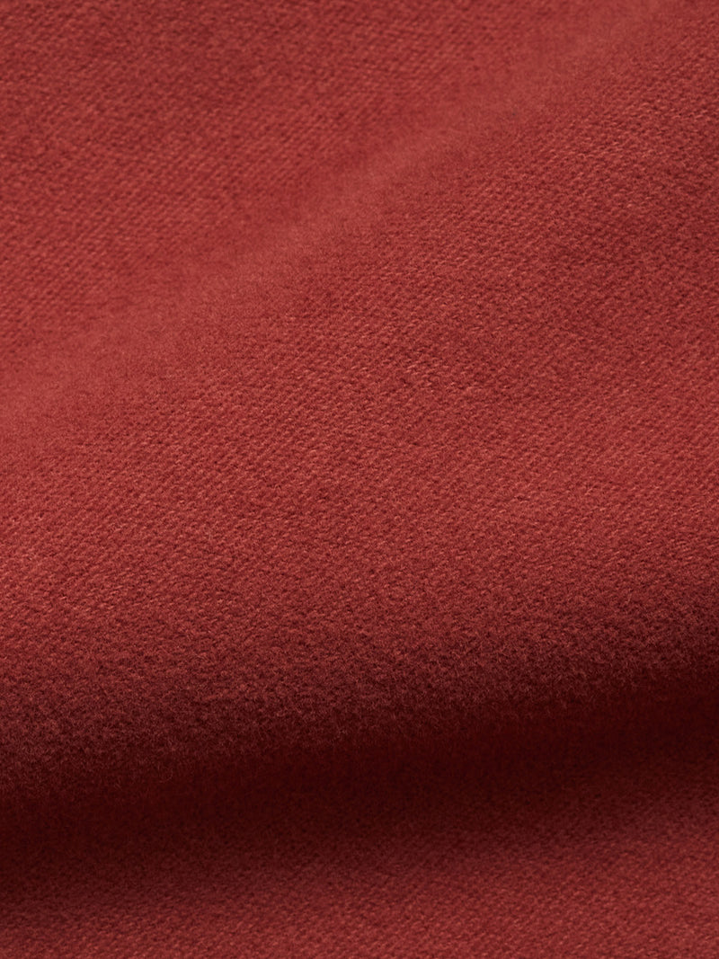 A close-up of soft, textured henna moleskin cotton with visible fibers and gentle folds evokes depth and warmth—ideal for the Blue de Gênes Nagano Overshirt - Henna.