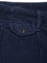 Close-up of Blue de Gênes Etsu Cord Chino - Navy, highlighting the waistband, belt loop, and small flap pocket with a black button. The relaxed fit and textured vertical corduroy ridges are clearly visible.