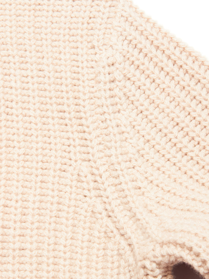 Close-up of the Yomaha Halfzip Knit - Fungi by Blue de Gênes, a beige wool-blend sweater featuring chunky textured knit, visible seam, and ribbed details.
