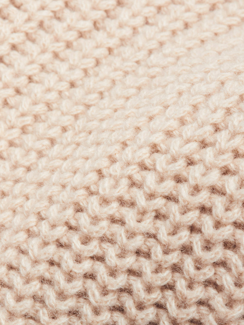 Close-up of the Yomaha Halfzip Knit - Fungi by Blue de Gênes, featuring a soft, cream-toned chunky knit with thick wool blend yarn and textured interlocking loops that showcase quality craftsmanship.