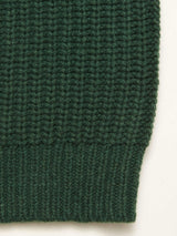 Close-up of Blue de Gênes Yomaha Halfzip Knit - Scarab, highlighting its ribbed green wool blend texture and pattern with a neatly finished bottom edge.