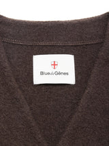 Close-up of the Koi Wool Gilet in Chocolate by Blue de Gênes, featuring a white label and red-and-white shield logo sewn inside the collar.