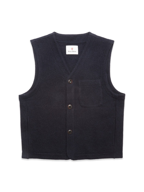 The Blue de Gênes Koi Wool Gilet in navy is a sleeveless, insulating wool vest with a V-neck, button front closure, and small chest pocket, shown laid flat on a white background.