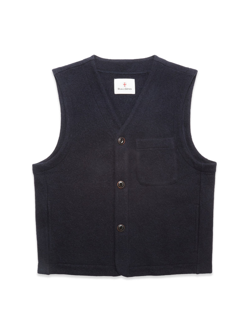 The Blue de Gênes Koi Wool Gilet in navy is a sleeveless, insulating wool vest with a V-neck, button front closure, and small chest pocket, shown laid flat on a white background.