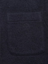 Close-up of the Koi Wool Gilet in Navy by Blue de Gênes, showing dark textured boiled wool and a large patch pocket—typical features of an insulating vest.