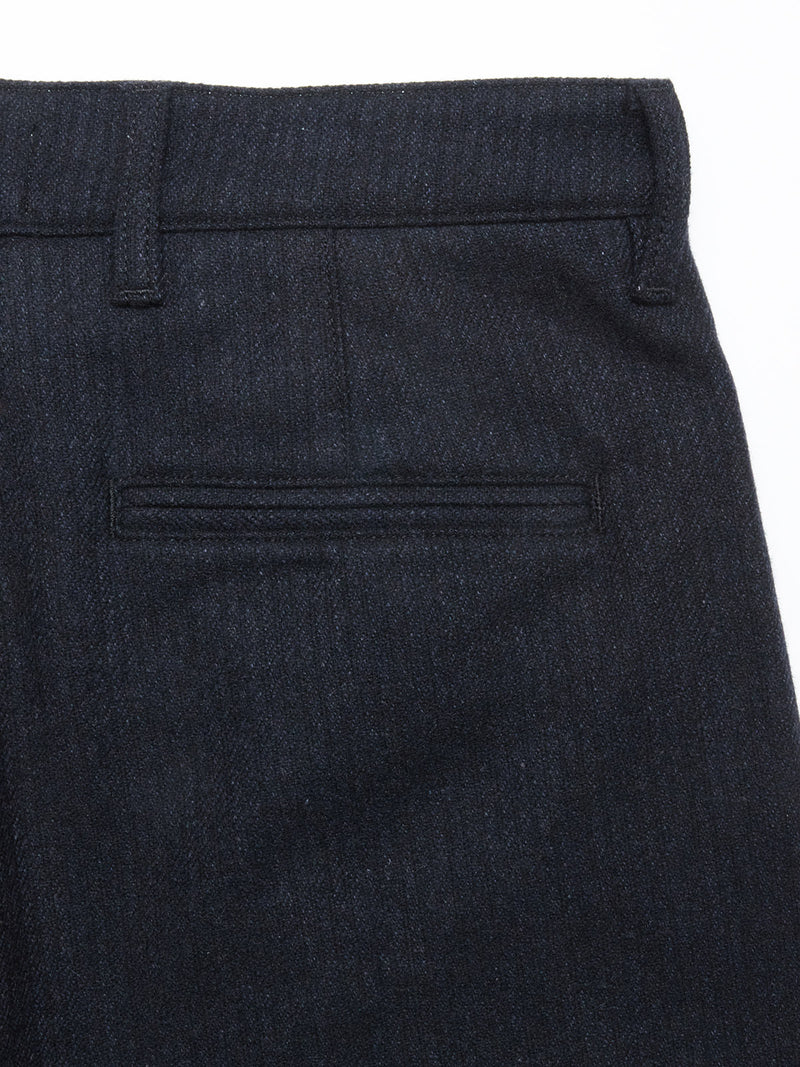 Close-up of the back pocket area on the Blue de Gênes Kibishi Solid Pant in Dark Navy, showing a single welt pocket, a belt loop section, and the waistband.