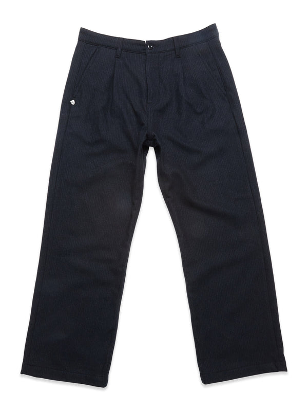 The Blue de Gênes Kibishi Solid Pant in dark navy is a straight-leg style crafted from an Italian wool blend with pleats, belt loops, and a button closure, shown laid flat on a white background.