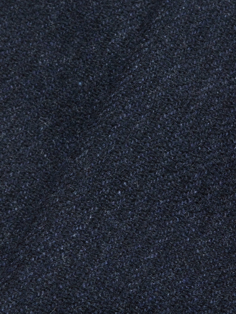 Close-up of the Blue de Gênes Kibishi Solid Pant in Dark Navy, featuring Italian wool-blend fabric with a textured, slightly fuzzy surface and a subtle diagonal crease—perfect for tailored pants.