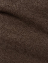 Close-up of the BGvinci Iro Pant in Hot Fudge Brown by Blue de Gênes, highlighting the distinct diagonal ridges and soft texture of its fabric, with subtle play of shadow and light—reminiscent of the premium comfort stretch twill used in these regular fit pants.