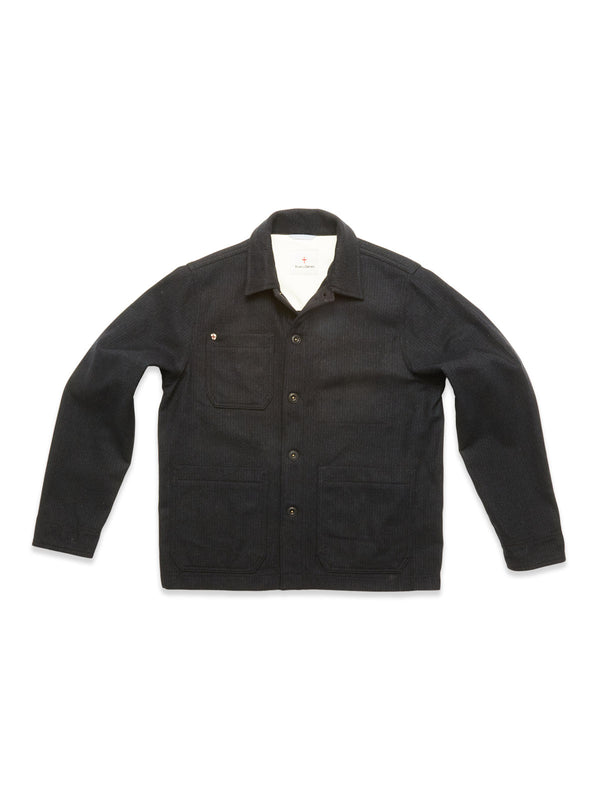 The Blue de Gênes Vincenzo Solid Jacket in dark navy is a relaxed fit with a collar, long sleeves, and three front pockets, shown laid flat on a white background.