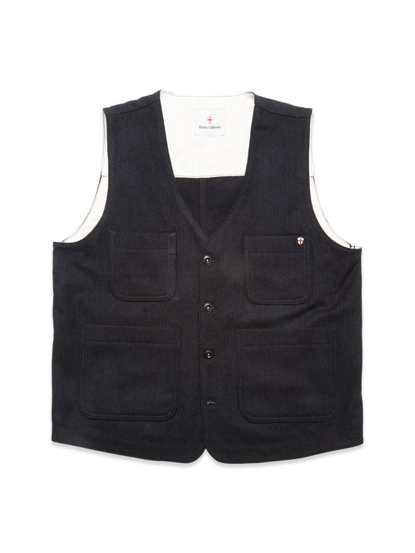 The Blue de Gênes Maurice Solid Gilet - Dark Navy is a sleeveless, V-neck denim vest with button closure, four front pockets, and a white inner lining—ideal for tailored layering. Shown against a white background.
