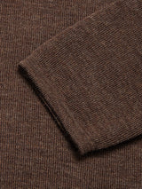 Close-up of the Toyama Knit L/S sweater by Blue de Gênes in brown, showing the sleeve cuff detail and textured knit pattern.