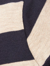 Close-up of the Blue de Gênes Toyama Stripe Knit L/S in Dark Navy, showcasing wide cream and navy stripes and a soft, textured yarn—ideal for cozy layering.